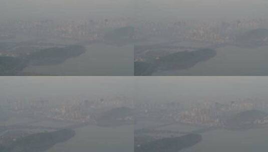 航拍武汉东湖公园清晨大雾江岸城市建筑高清在线视频素材下载