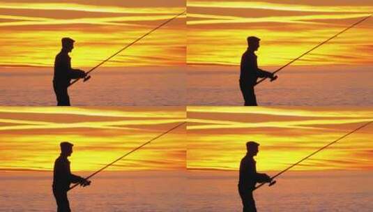 海上日落时拿着鱼竿的渔夫剪影高清在线视频素材下载