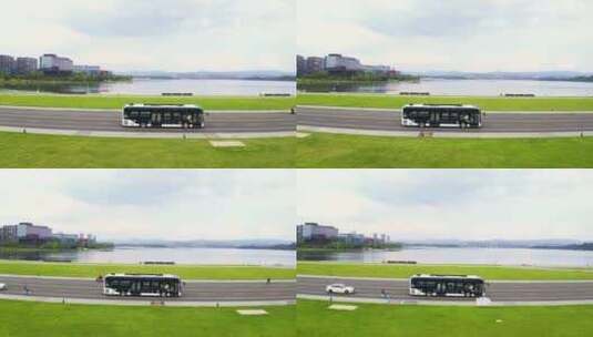 航拍公交车(大巴车)行驶在公园城市高清在线视频素材下载