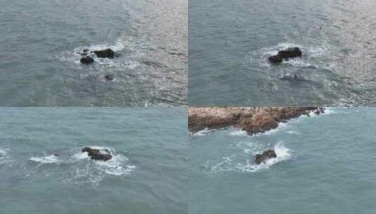 俯拍海岸礁石海浪拍打岩石海水海边浪花潮水高清在线视频素材下载