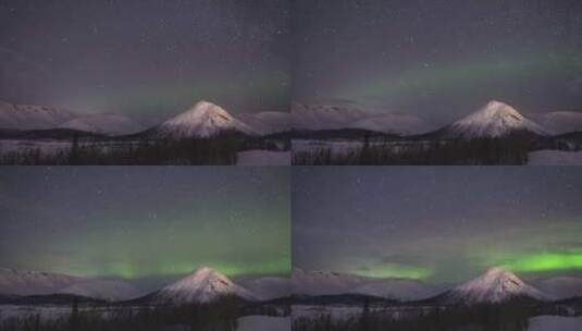 冬夜雪山的夜空星空和绿色北极光高清在线视频素材下载