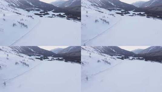 航拍新疆冬季喀纳斯神仙湾晨雾雪山森林雪景高清在线视频素材下载