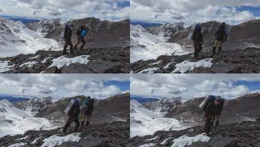 攀登四川岷山山脉主峰雪宝顶雪峰的登山队高清在线视频素材下载