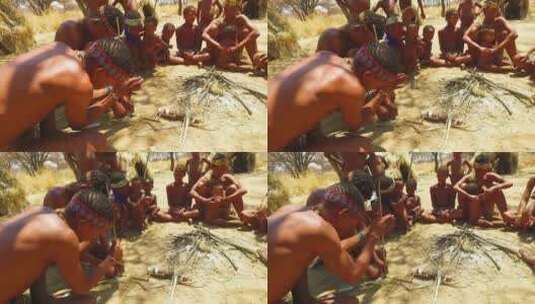 非洲圣部落的丛林人在原始小村庄用传统方式生火高清在线视频素材下载
