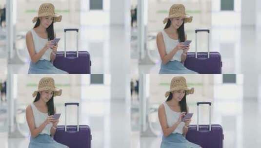 女旅客在机场候机时玩手机高清在线视频素材下载