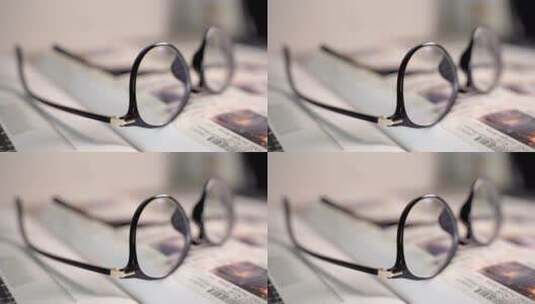 书本上的眼镜特写镜头4K高清在线视频素材下载