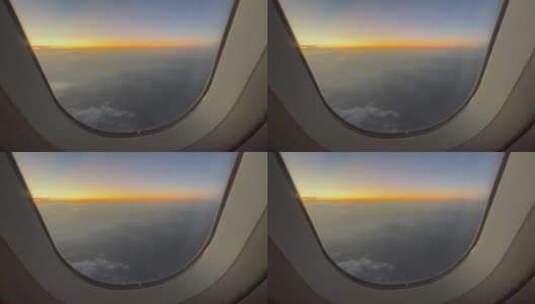 云层之上飞机舷窗外的傍晚自然风光高清在线视频素材下载