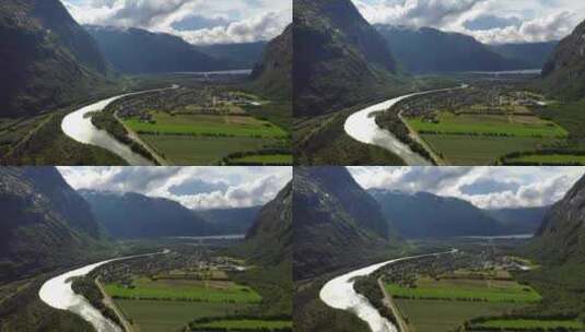 航拍河流旁的村庄高清在线视频素材下载