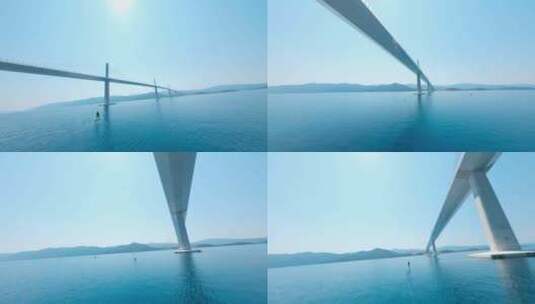FPV穿越机无人机航拍跨海大桥飞翼滑翔高清在线视频素材下载