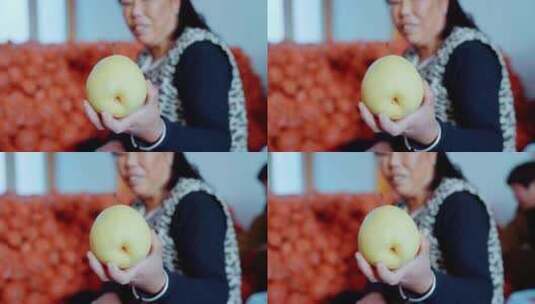 农妇手里的大酥梨高清在线视频素材下载