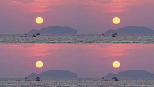 海南三亚橘红色夕阳晚霞下行驶的豪华游艇高清在线视频素材下载