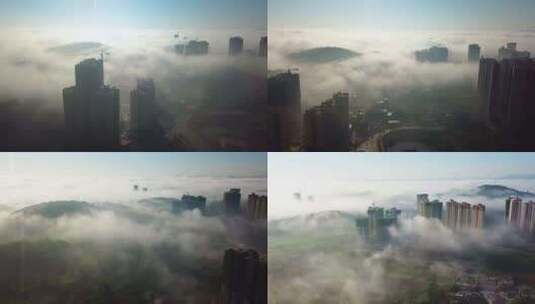 航拍雾下城市高清在线视频素材下载