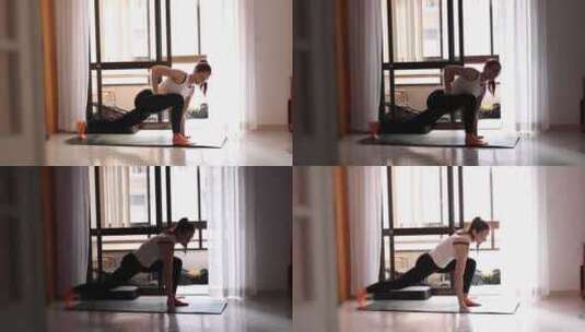 一个女人正在客厅做瑜伽姿势高清在线视频素材下载