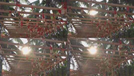 南海岛旅游在椰树下许愿浪漫的风铃声高清在线视频素材下载
