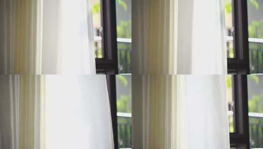 风吹窗帘窗户白色窗帘飘动阳光透过白色窗帘高清在线视频素材下载