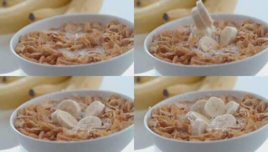 香蕉被添加到一碗玉米片和牛奶中高清在线视频素材下载