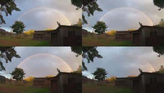 雨云和小村庄上空的双彩虹高清在线视频素材下载