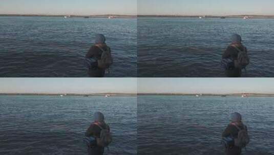 一个在海边钓鱼的人高清在线视频素材下载