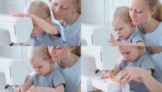 母亲抱着婴儿使用缝纫机高清在线视频素材下载