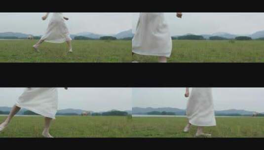 白色连衣裙女子在草原上旋转跳舞舞步特写高清在线视频素材下载