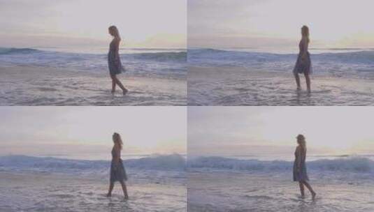 美丽的女人行走在海边高清在线视频素材下载