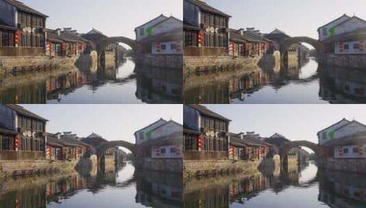 航拍湖州南浔江南古镇河流拱桥倒影老房子高清在线视频素材下载