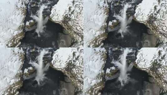空中拍摄的冬季森林瀑布的顶部照片高清在线视频素材下载