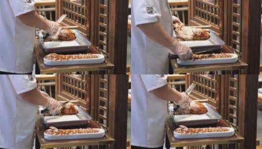 中国烤鸭厨师在切烤鸭高清在线视频素材下载