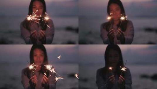 女子拿着火花庆祝新年高清在线视频素材下载