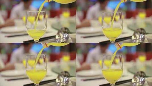 橙汁碳酸水倒进玻璃杯高清在线视频素材下载