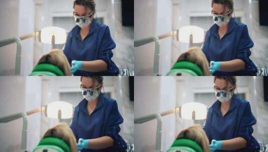 女性牙医在给病人检查牙齿高清在线视频素材下载