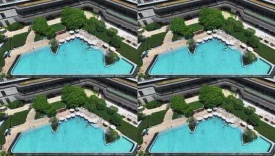 航拍城市旅游度假酒店设施蓝色水面游泳池高清在线视频素材下载