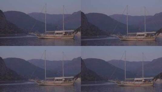 日落海岸边停靠的帆船高清在线视频素材下载