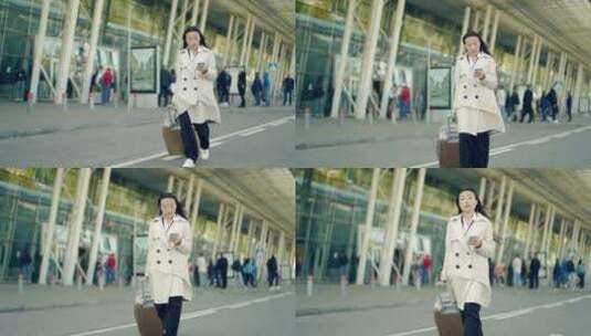 亚洲女旅游女商人带着手提箱从航站楼机场背高清在线视频素材下载