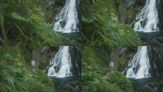 在奥地利高地欣赏瀑布的女人。在山里旅行，高清在线视频素材下载