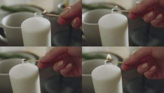 用燃烧的火柴点燃蜡烛高清在线视频素材下载