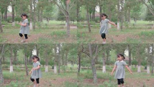 在公园草坪上玩耍的中国女孩高清在线视频素材下载