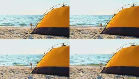 海滩上的黑黄相间的露营帐篷高清在线视频素材下载