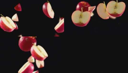 黑色背景下红色苹果和切片的飞行高清在线视频素材下载