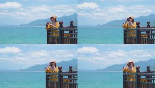 海南万宁石梅湾一个美女在海边拍照高清在线视频素材下载