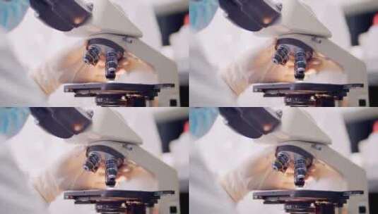 实拍实验室科研人员操作显微镜实验高清在线视频素材下载