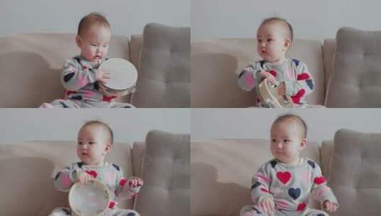 可爱小宝宝玩手鼓声乐玩具特写慢镜头高清在线视频素材下载
