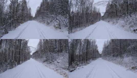 5K行驶在林海雪原的雪路上高清在线视频素材下载