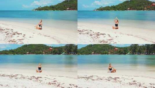 女人在海滩上做瑜伽打坐高清在线视频素材下载