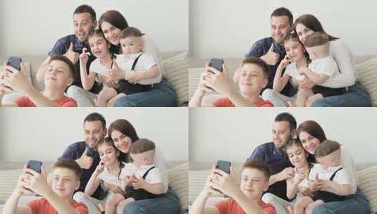 小男孩用手机给一家人合影高清在线视频素材下载