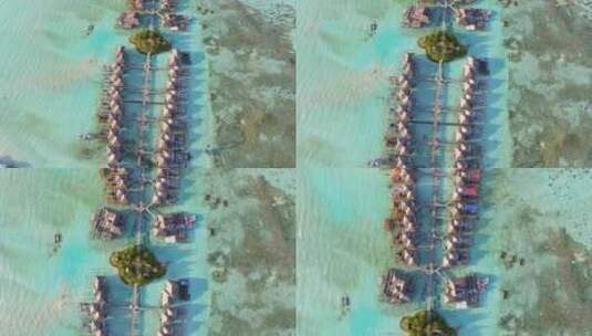 航拍海上度假屋海边沙滩海浪绿树林马尔代夫高清在线视频素材下载