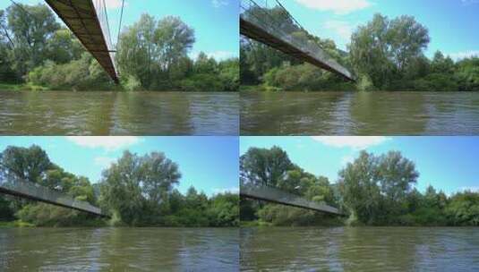 斯洛伐克阳光明媚的夏日，无人驾驶飞机在河上的桥下飞行高清在线视频素材下载