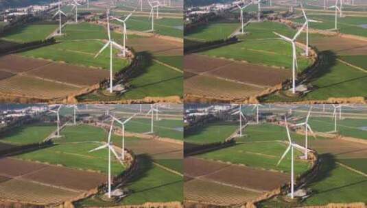 航拍农田里风力发电设备高清在线视频素材下载