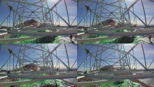 4K西藏5200米雪山电力铁塔组立横担吊装03高清在线视频素材下载