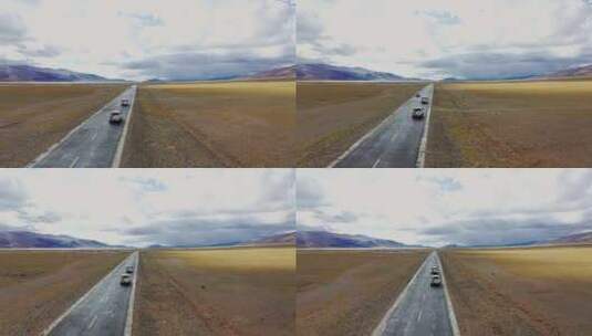 航拍越野车行驶在草原公路上高清在线视频素材下载